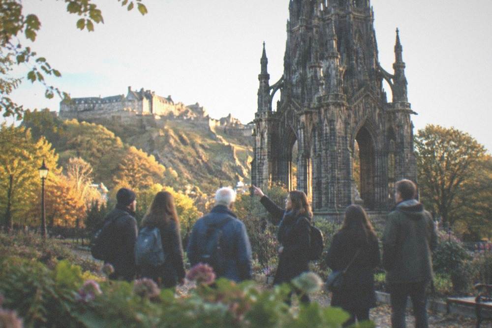 Flowerbeds and the Gothic spire of the Scott Monument in Princes Street Gardens below the castle