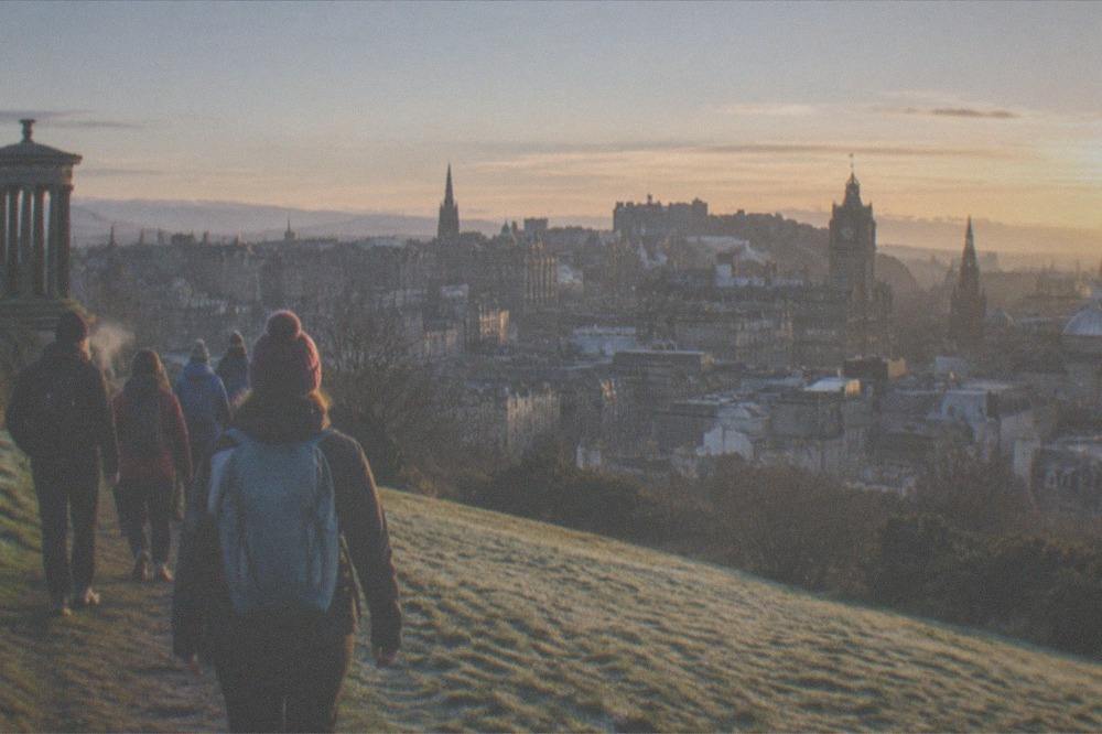 View across Edinburgh Old Town rooftops from a hill above the city